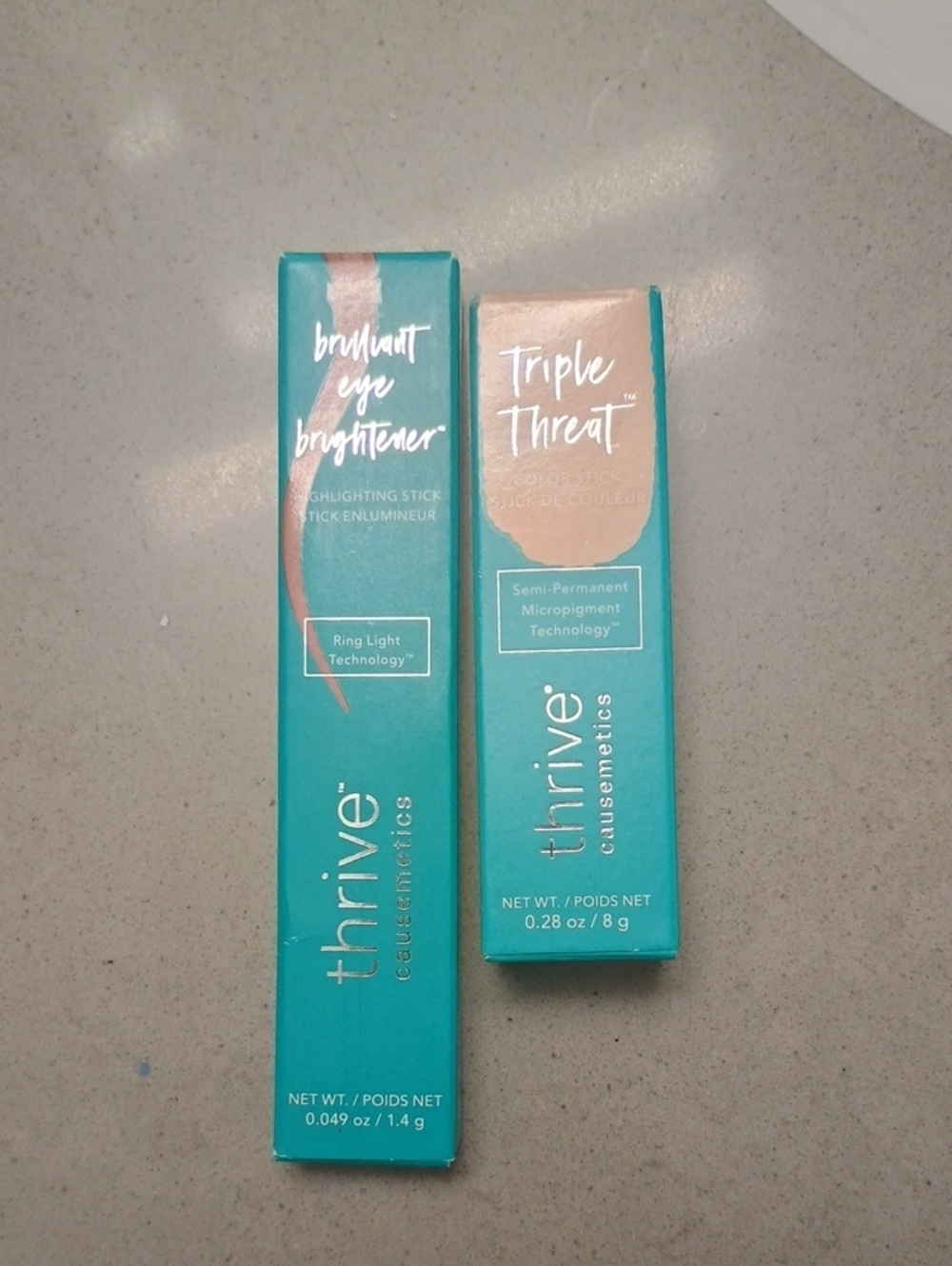 thrive causemetics Brightening Eye Stick Duo in Teal & Champagne
